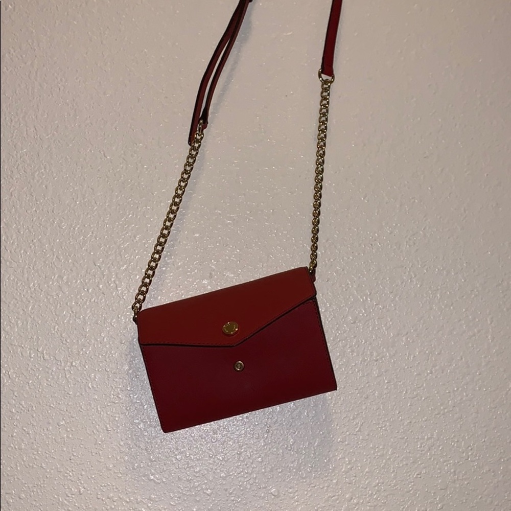 cross body wallet size bag with slot for a phone.